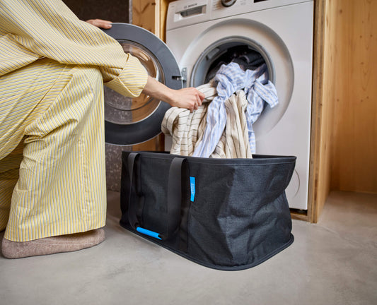 [hidden] [lifestyle] Hold-All™ Black Collapsible 35L Laundry Basket